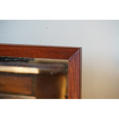 820 - A Modern Mirror in a Mahogany Frame. Measuring: 69cms x 102cms.