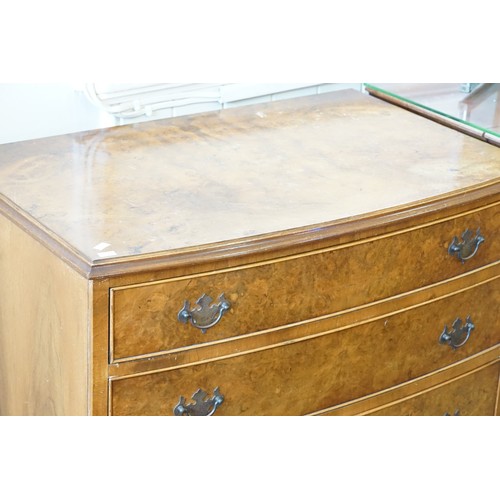 601 - A Reproduction Walnut Veneered Bow Fronted Chest fitted with four graduated Drawers & Resting on Bra... 