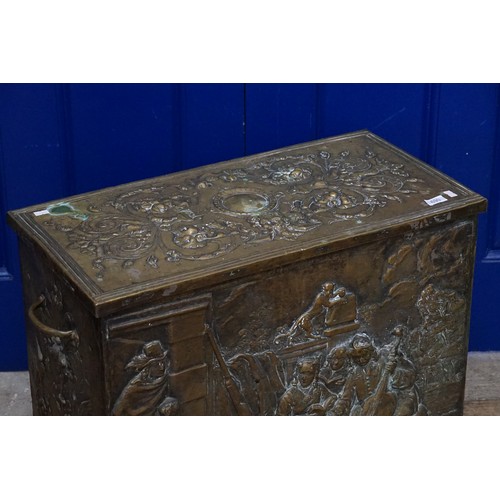 690 - A Dutch Brass embossed Log Box with Decoration & Side Handles. Measuring: 65cmsa across x 33cms deep... 