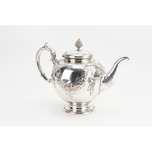 95 - A Victorian Silver Plated Tea Pot decorated with Swags & Scrolls with a Pineapple Finial.