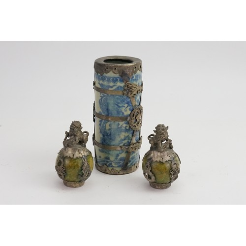 752 - A Pewter metal mounted Dragon decorated Vase along with two Shi Shi decorated finials.