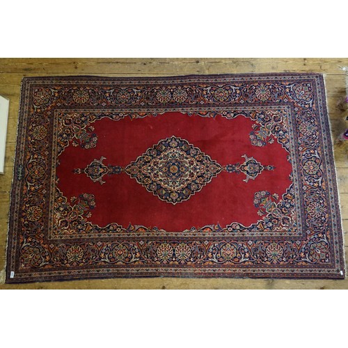 659 - An Antique Red Ground Floral Bordered Central Medallion Quadruple cornered Silk Pile Carpet. Measuri... 