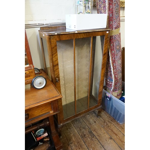 647 - A 1950s Walnut Display Cabinet. Measuring: 57cms across x 113cms high x 26cms deep