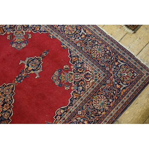 659 - An Antique Red Ground Floral Bordered Central Medallion Quadruple cornered Silk Pile Carpet. Measuri... 