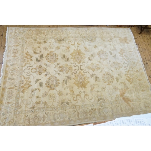 655A - A Large Cream & Beige Floral Pattern, Fringe Edged Rug. Measuring: 370cms x 270cms.