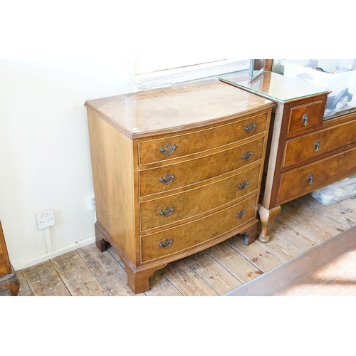 469 - A Reproduction Walnut Veneered Bow Fronted Chest fitted with four graduated Drawers & Resting on Bra... 