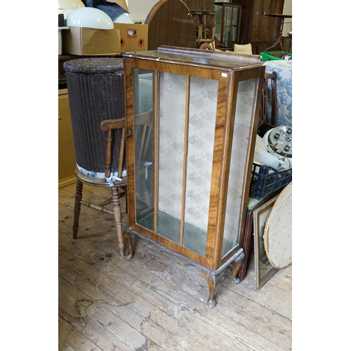 477 - A 1950s Walnut Display Cabinet. Measuring: 57cms across x 113cms high x 26cms deep