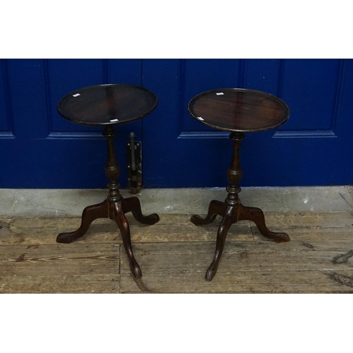 487 - A Pair of Wine Tables resting on pedestal Tripod Bases. Measuring: 50cms high x 30cms Top.