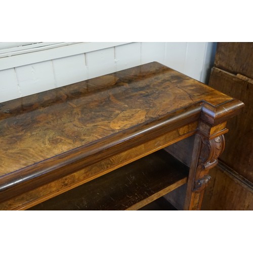 494 - A Victorian Walnut veneered Line inlaid Bookcase fitted with shelves & a Carved Scrolled Column. Mea... 