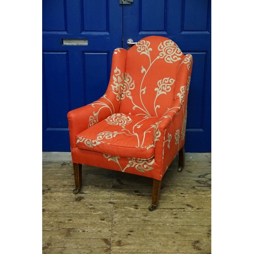 502 - An Edwardian Queen Anne design Semi-Winged Hoop Back Easy Chair with Roll-Over Arms resting on turne... 