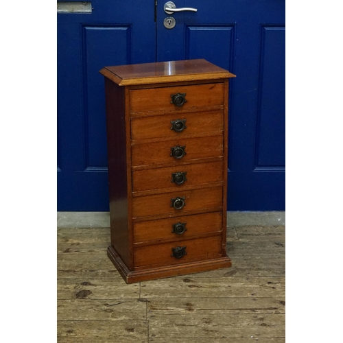 506 - An Antique Mahogany Filing Chest of Seven Drawers resting on a shaped base & a moulded top. Measurin... 