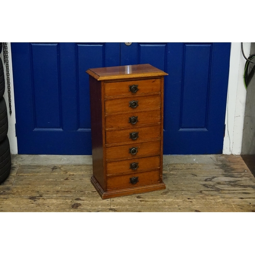 506 - An Antique Mahogany Filing Chest of Seven Drawers resting on a shaped base & a moulded top. Measurin... 