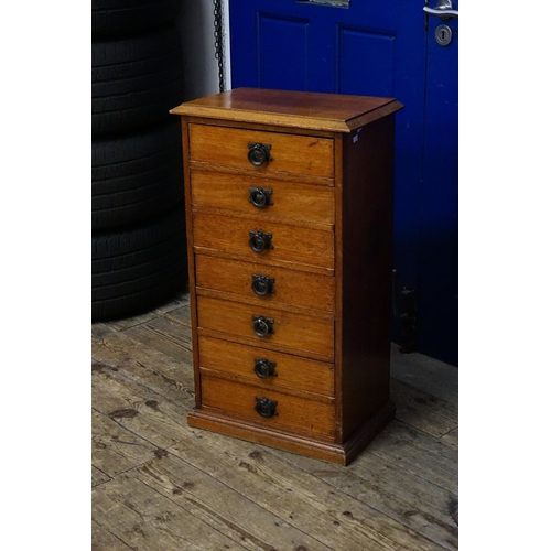 506 - An Antique Mahogany Filing Chest of Seven Drawers resting on a shaped base & a moulded top. Measurin... 