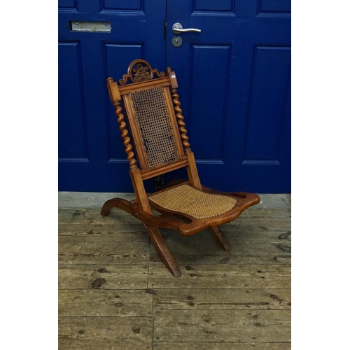 515 - A Late 19th Century Bergere panelled Folding Coaching Chair with Barley Twist Supports.