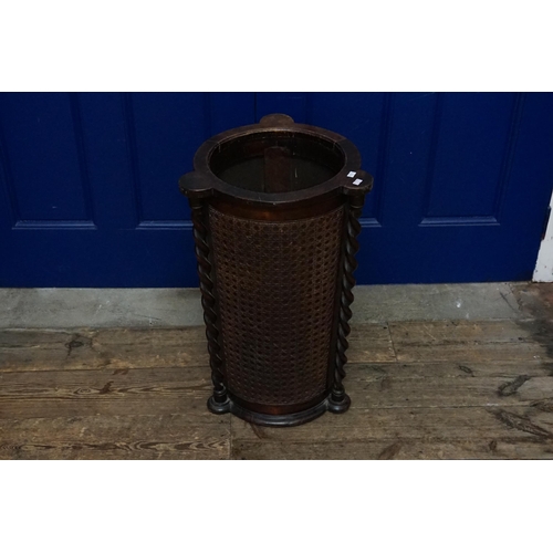 522 - An Edwardian Bergere & Barley Twist Umbrella Stand or circular Form. Measuring: 64cms High.