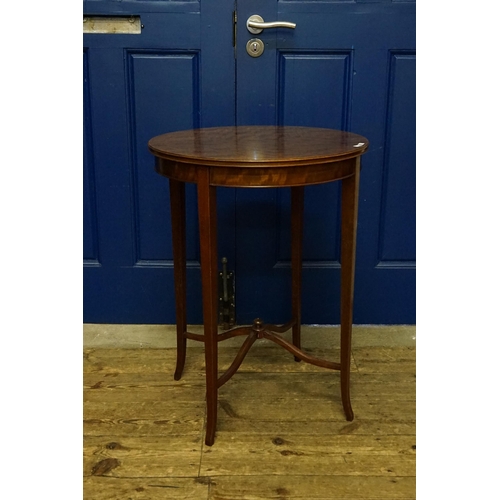 525 - An Edwardian Mahogany & flame Topped Lamp Table with a fixed label 