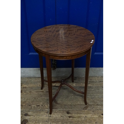 525 - An Edwardian Mahogany & flame Topped Lamp Table with a fixed label 