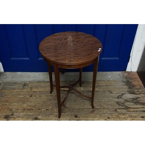 525 - An Edwardian Mahogany & flame Topped Lamp Table with a fixed label 