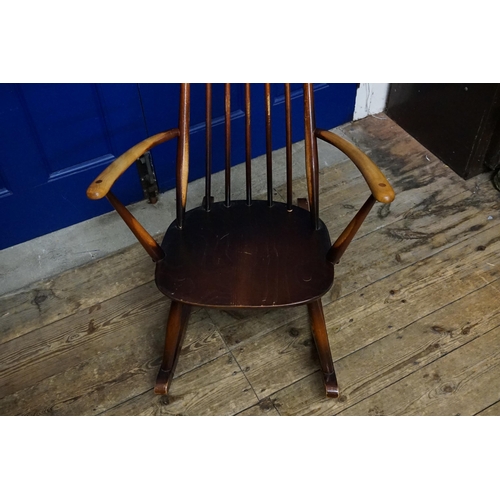 529 - A Yew Seated & stained as Beech Splat Back Rocking Chair with shaped cresting rail.