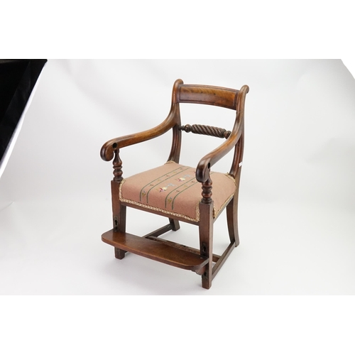 531 - A Regency Mahogany Child's Chair with a Rope Twist Back, Swan Neck Arms, alternating Foot Step & a f... 