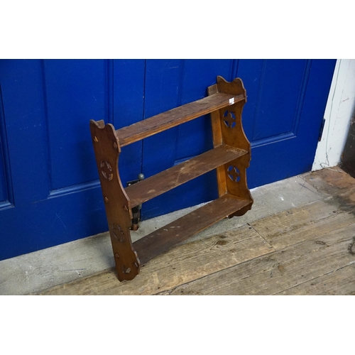 534 - A Pierced Oak Set of Wall Shelves. Measuring: 52cms across x 53cms high x 13cms deep.