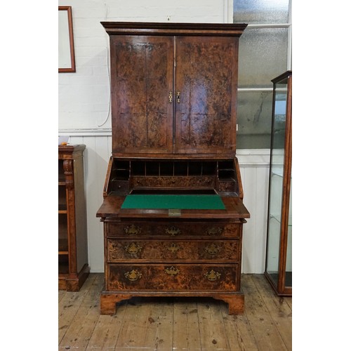 548 - An early 18th Century walnut feather banded and stained field maple bureau bookcase. Email from Bonh... 