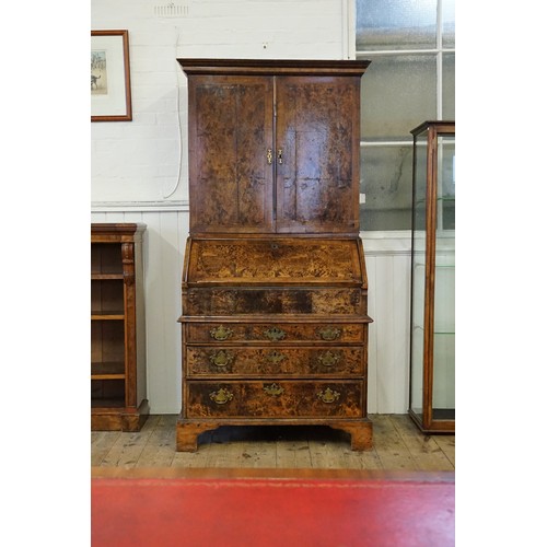 548 - An early 18th Century walnut feather banded and stained field maple bureau bookcase. Email from Bonh... 