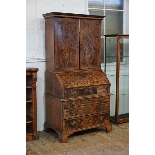 548 - An early 18th Century walnut feather banded and stained field maple bureau bookcase. Email from Bonh... 