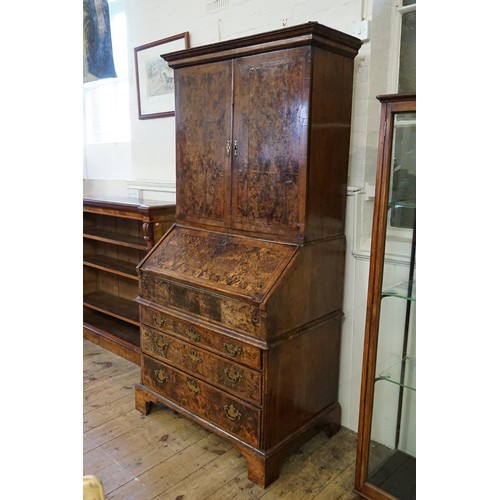 548 - An early 18th Century walnut feather banded and stained field maple bureau bookcase. Email from Bonh... 