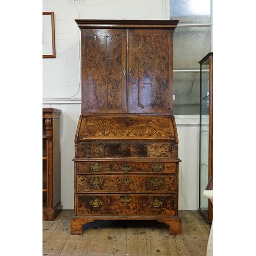 548 - An early 18th Century walnut feather banded and stained field maple bureau bookcase. Email from Bonh... 