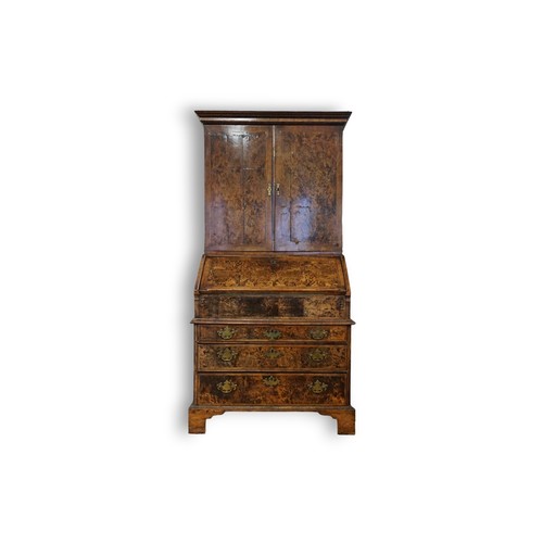 548 - An early 18th Century walnut feather banded and stained field maple bureau bookcase. Email from Bonh... 