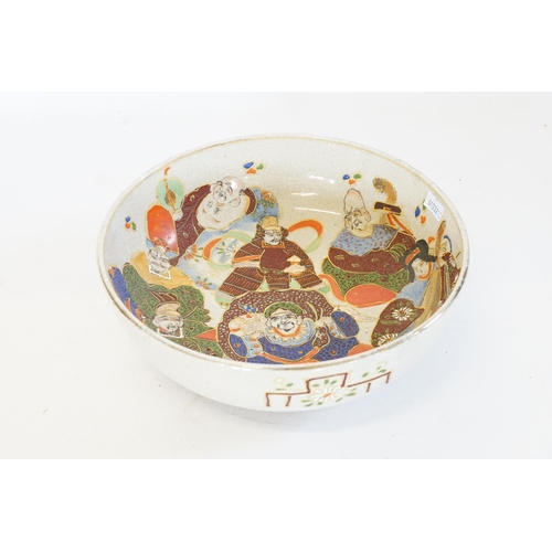 278 - A Japanese Satsuma decorated with scribes & musicians in a crackle glaze, stamped 