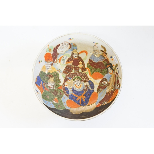 278 - A Japanese Satsuma decorated with scribes & musicians in a crackle glaze, stamped 