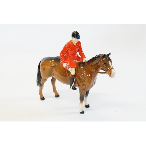 409 - A Beswick study of a Fox Hunter in Red Coat & Brown Horse.