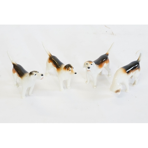 423 - A Group of Four Beswick Dogs.