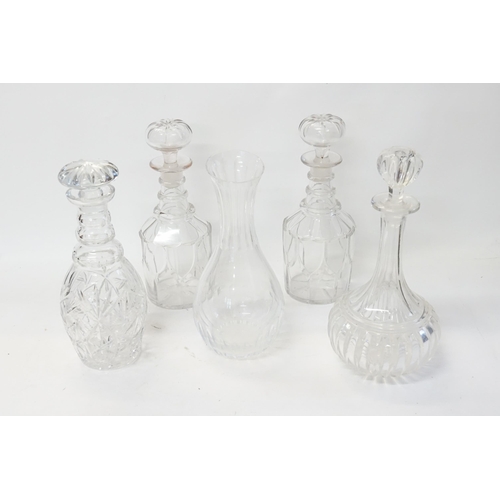 673 - Four Ring Neck Glass Decanters along with a Carafe.