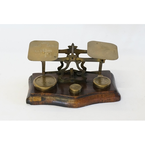 581 - A Set of Victorian Brass Letter Scales on a Mahogany Stand.