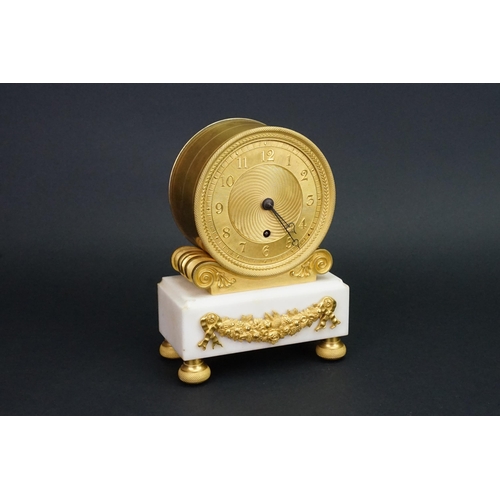 244 - A Circa 1820 Regency ormolu and white marble mantel clock, with an eight day chain fusee movement, t... 