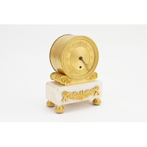 244 - A Circa 1820 Regency ormolu and white marble mantel clock, with an eight day chain fusee movement, t... 