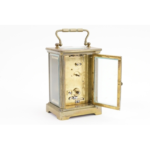 245 - A Brass Cased French Movement 4 Plate Carriage Clock with an enamelled dial & visible escapement wit... 