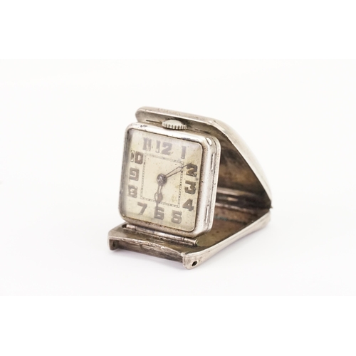 309 - A Circa 1920 Silver Fold-Out Travel Watch with various markings from Brevet Texa 0.935 A*M, etc. Thi... 