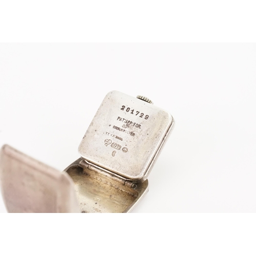 309 - A Circa 1920 Silver Fold-Out Travel Watch with various markings from Brevet Texa 0.935 A*M, etc. Thi... 