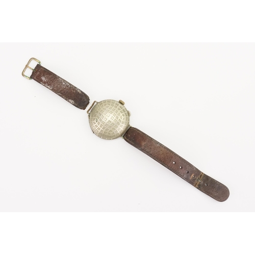 311 - A World War I 1920s Trench Watch with a Stainless Steel Face Covering on a Brown Leather Strap. Watc... 