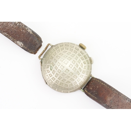 311 - A World War I 1920s Trench Watch with a Stainless Steel Face Covering on a Brown Leather Strap. Watc... 