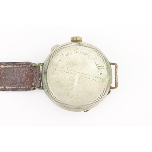 311 - A World War I 1920s Trench Watch with a Stainless Steel Face Covering on a Brown Leather Strap. Watc... 