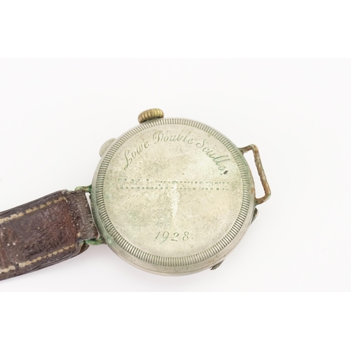 311 - A World War I 1920s Trench Watch with a Stainless Steel Face Covering on a Brown Leather Strap. Watc... 