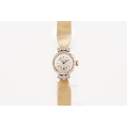 206 - A ladies 9ct Gold Diamond set Movado cocktail watch. 9ct Gold Milanese strap. Weight total 19g. In o... 