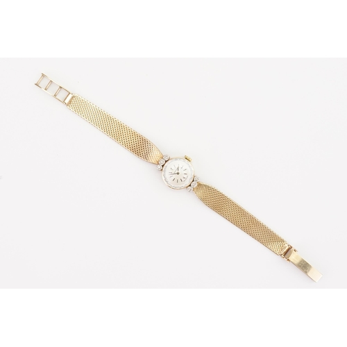 206 - A ladies 9ct Gold Diamond set Movado cocktail watch. 9ct Gold Milanese strap. Weight total 19g. In o... 