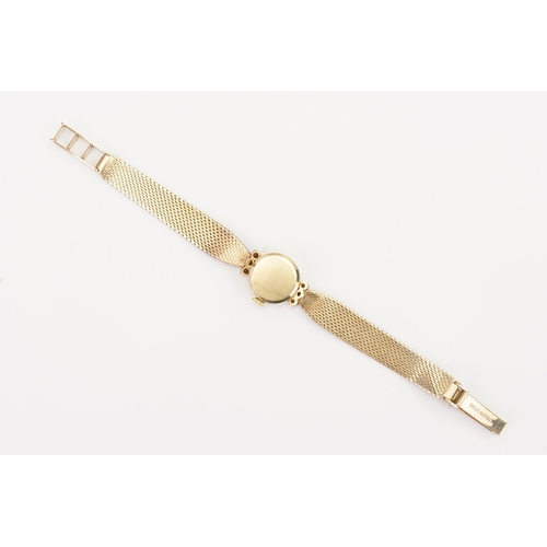 206 - A ladies 9ct Gold Diamond set Movado cocktail watch. 9ct Gold Milanese strap. Weight total 19g. In o... 