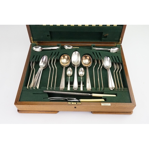 61 - A Walnut Cased Part Canteen of Cutlery by 